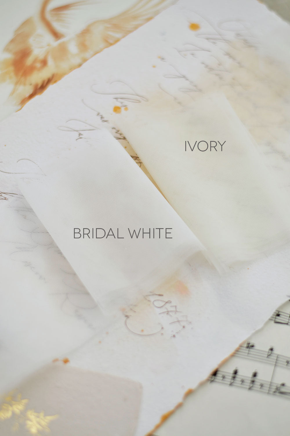 Folded soft tulle samples in ivory annd white
