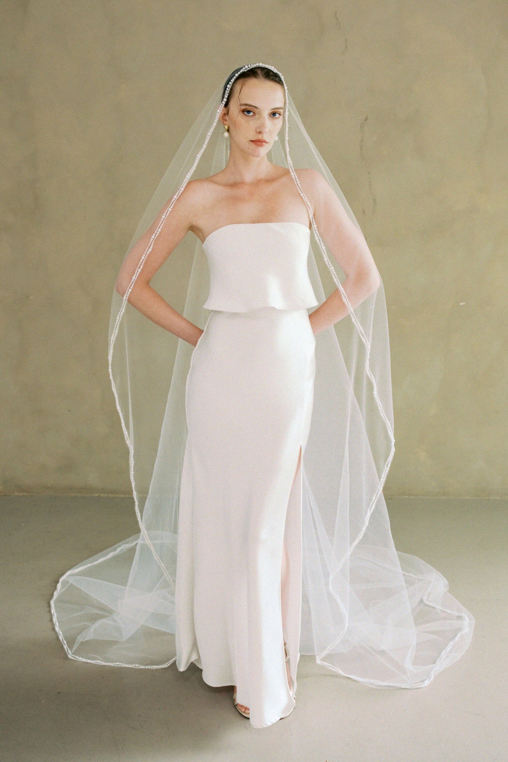 model wears a one-tier mantilla pearl edge veil