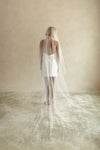 A model wearing always and forever embroidered veil by Madame Tulle bridal