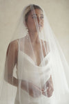 A model wearing a two tier veil over her face