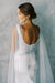 Model wears a detachable tulle wings with pearls