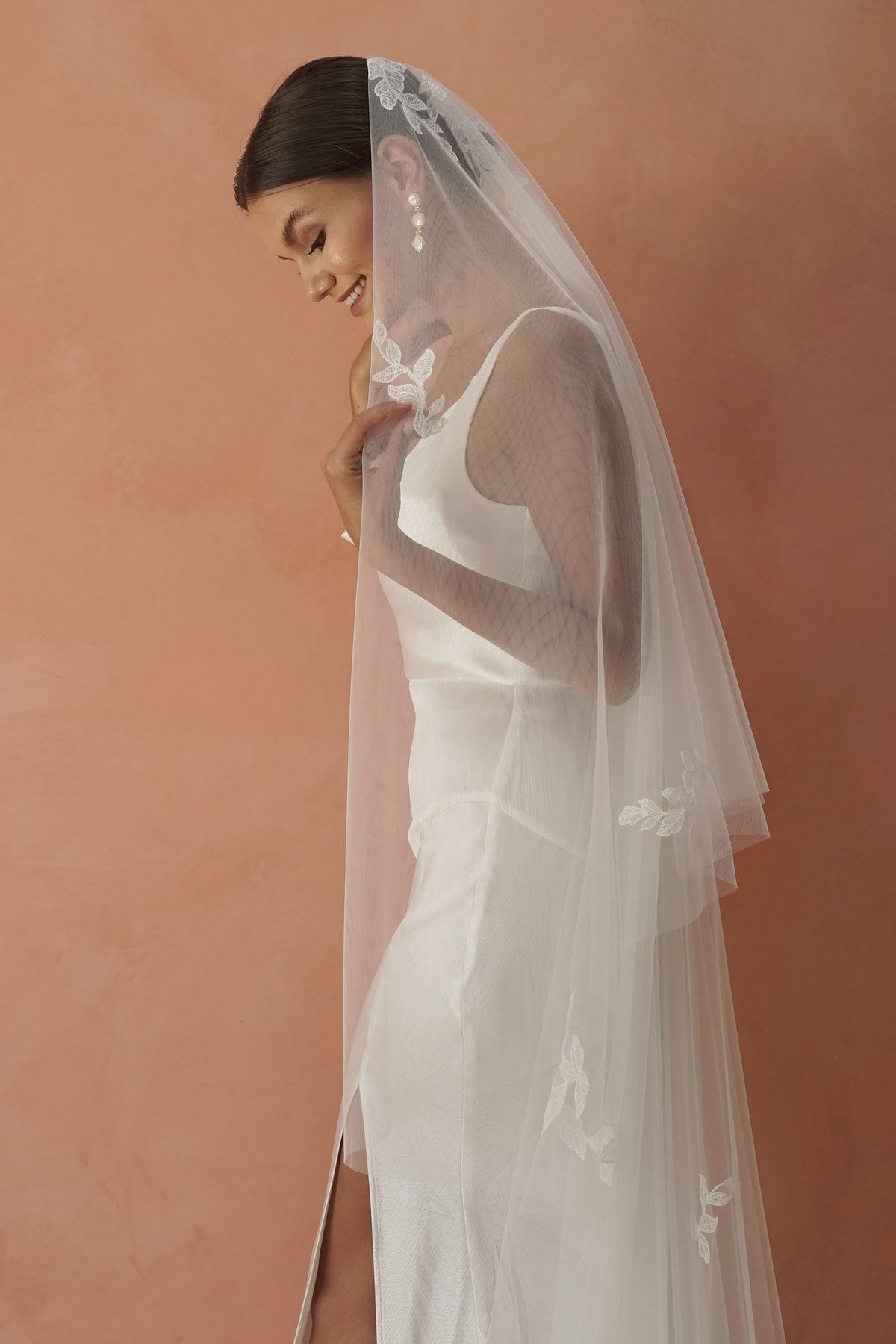 model wears two-tier lace appliqués wedding veil, drop veil with lace appliqués
