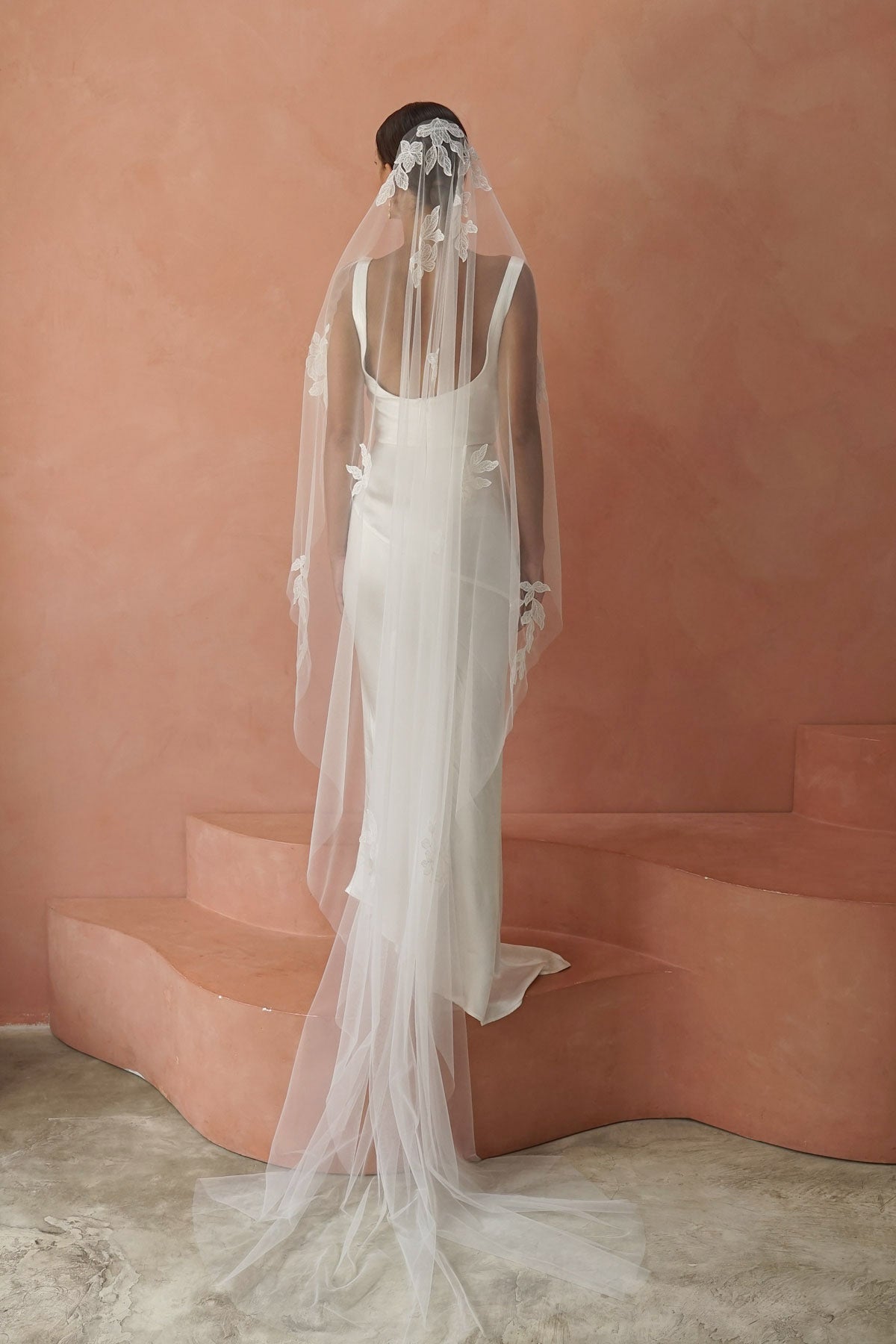 model wears one-tier lace appliqués wedding veil