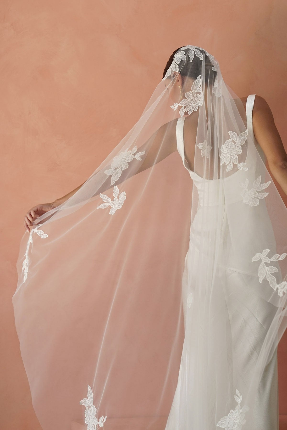 model wears one-tier lace appliqués wedding veil