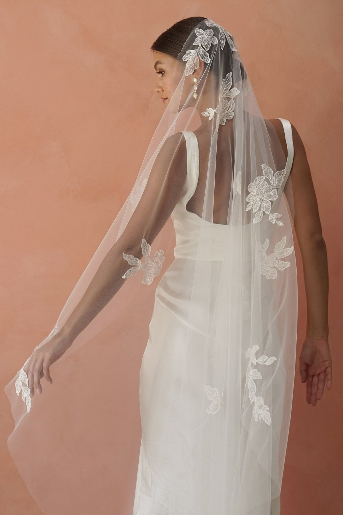 model wears one-tier lace appliqués wedding veil