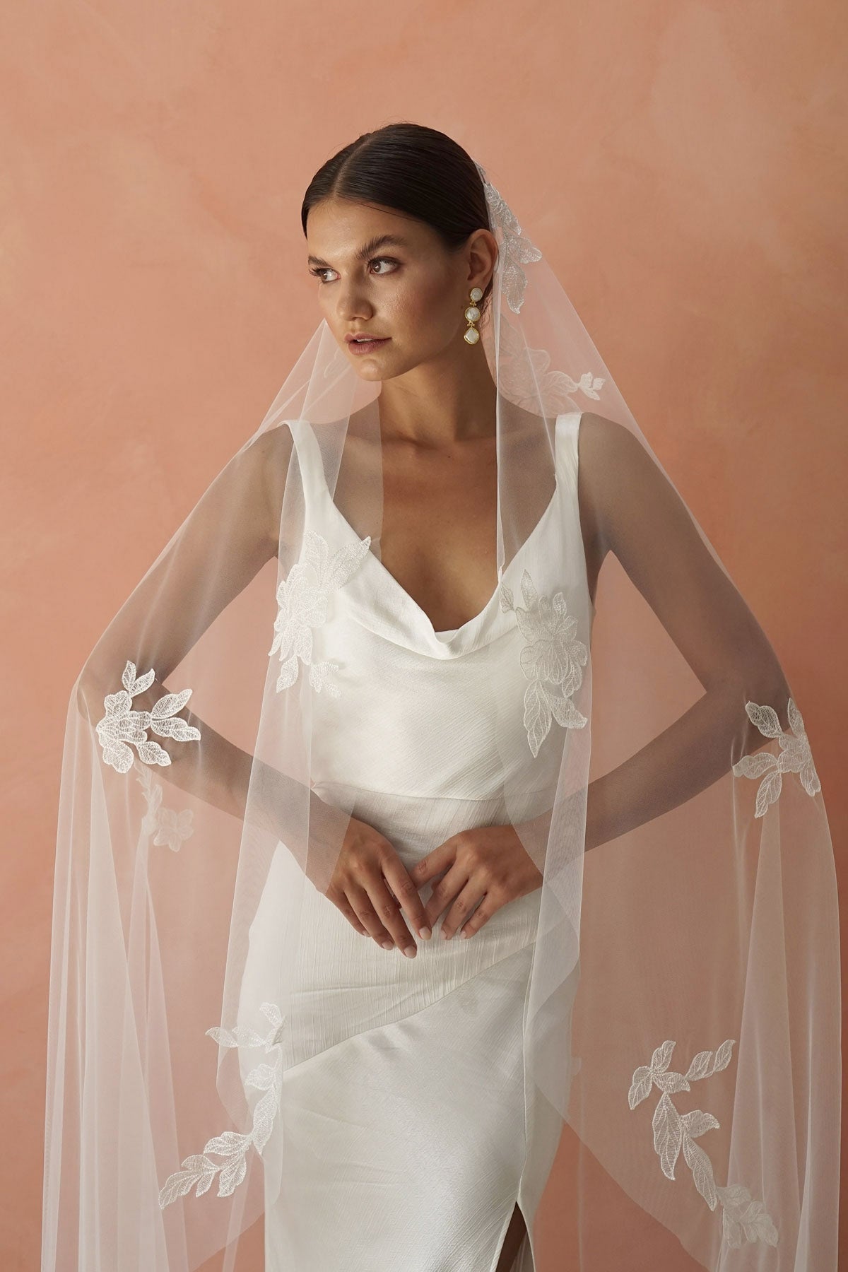 model wears one-tier lace appliqués wedding veil