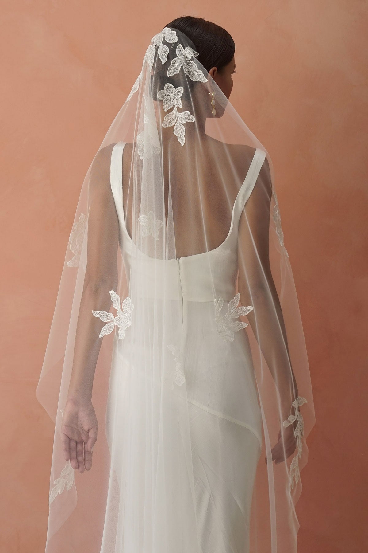 model wears one-tier lace appliqués wedding veil