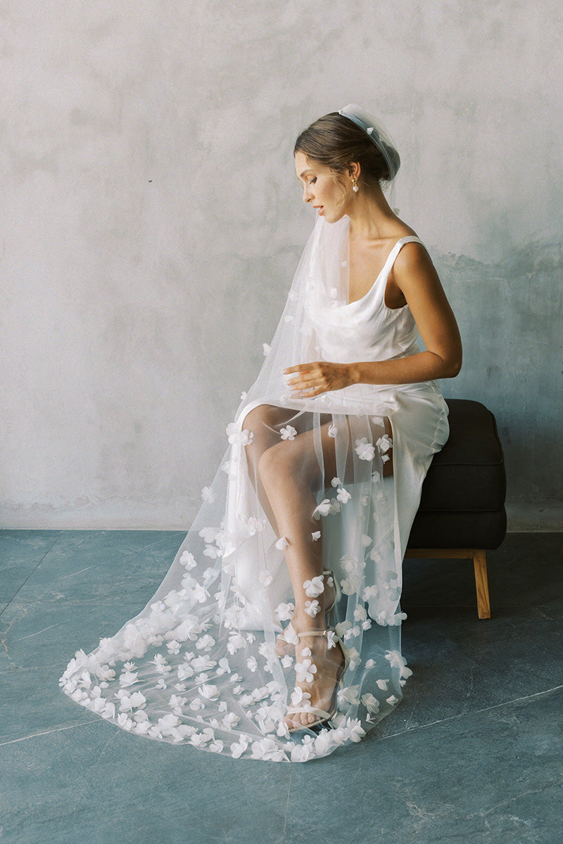 model wears one tier three dimensional organza flowers, wedding veil with flowers