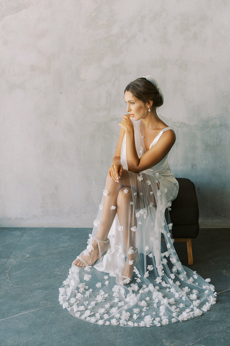model wears one tier three dimensional organza flowers, wedding veil with flowers