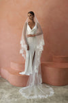 A model wearing COLETTE II, a two tier lace wedding veil by Madame Tulle