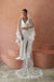 A model wearing COLETTE II, a two tier lace wedding veil