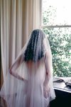 A model wearing MARIBEL II two tier pearl wedding veil by Madame Tulle