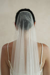 A model wearing a one tier wedding veil with crystals by Madame Tulle