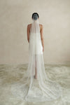 A model wearing a one tier wedding veil with crystals by Madame Tulle