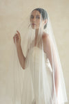 A model wearing STELLA II, a two tier wedding veil with crystals by Madame Tulle