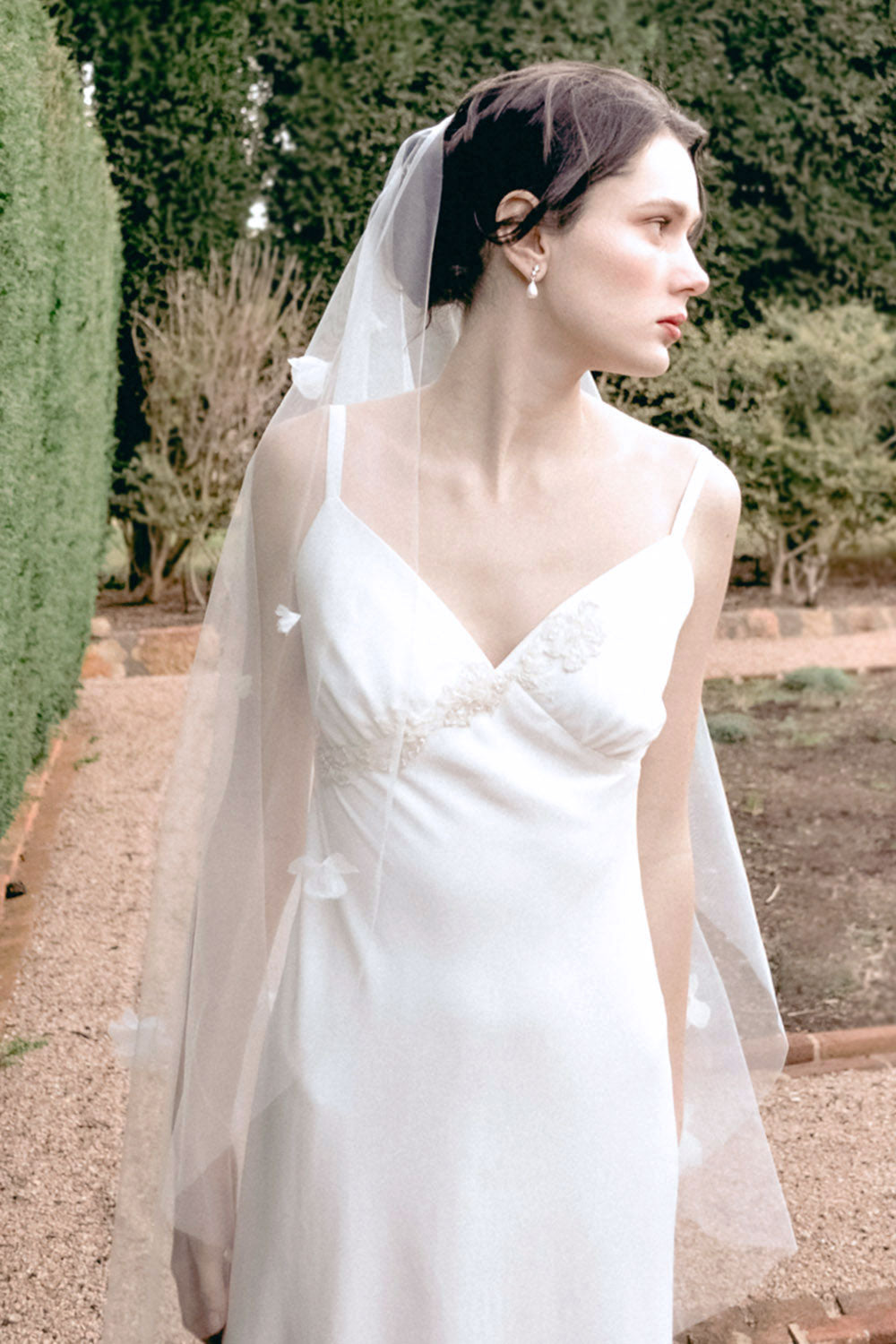 Model wearing a one tier floral wedding veil made by Madame Tulle Australia