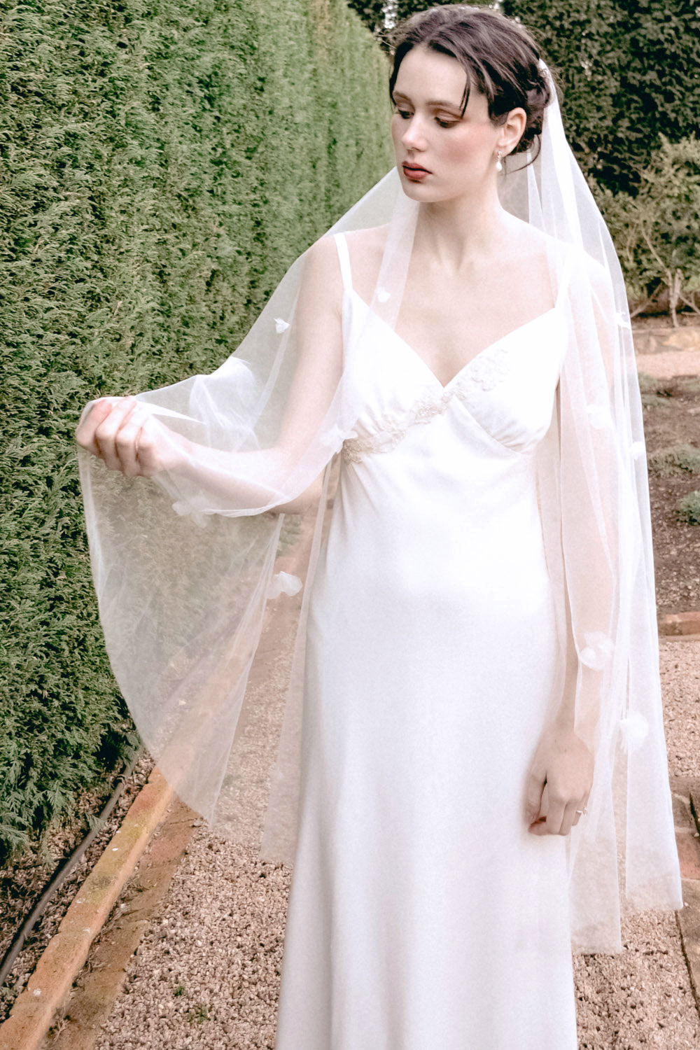 Model wearing a one tier floral wedding veil made by Madame Tulle Australia