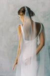 A model wearing the ELLA I minimalist one tier wedding veil by Madame Tulle bridal Sydney
