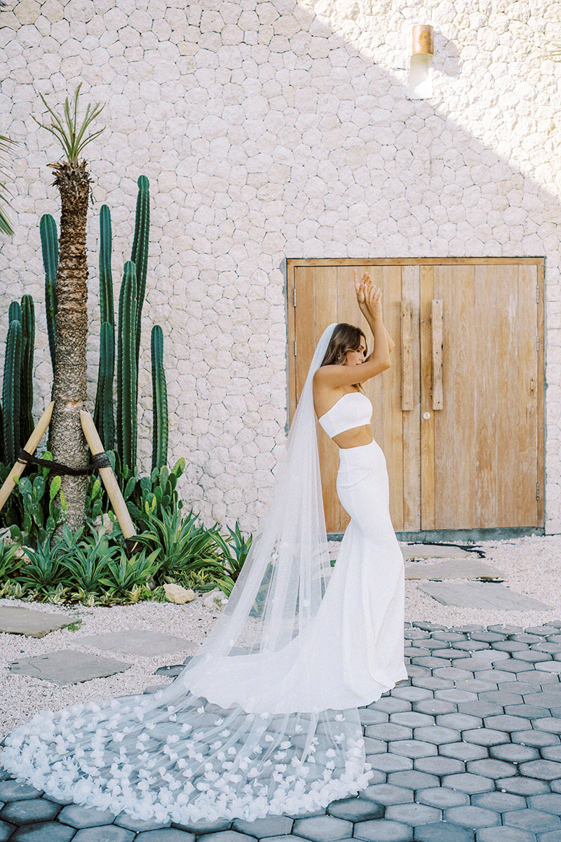 model wears wedding veil with organza flowers, floral veil