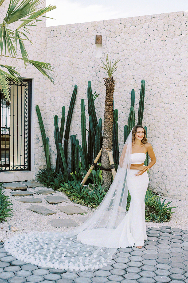 model wears wedding veil with organza flowers, floral veil
