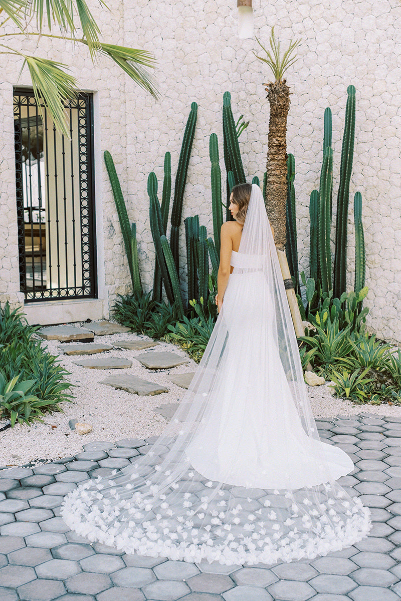 model wears wedding veil with organza flowers, floral veil
