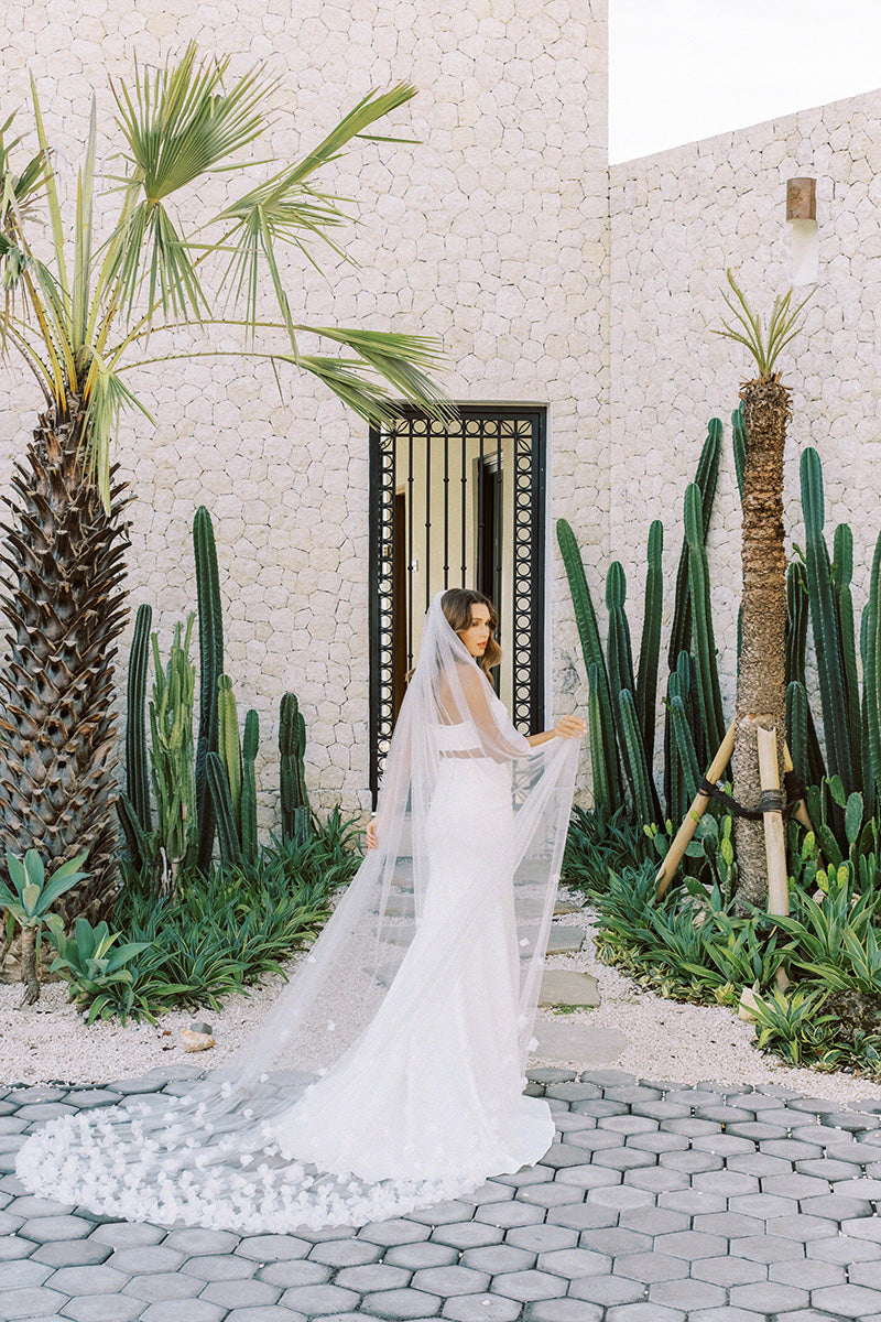 model wears wedding veil with organza flowers, floral veil