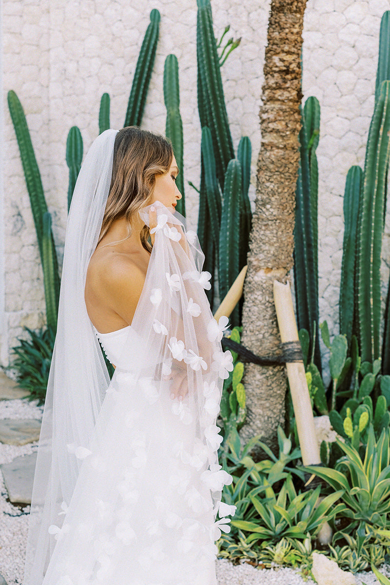model wears wedding veil with organza flowers, floral veil