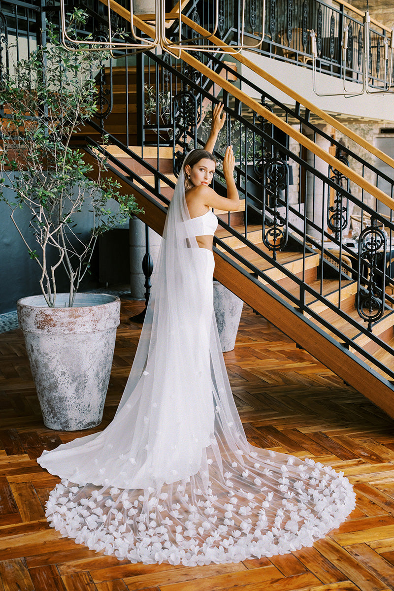 model wears wedding veil with organza flowers, floral veil