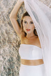 A model wearing a one tier pearl wedding veil 