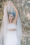 A model wearing a one tier pearl wedding veil by Madame Tulle