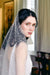 A model wearing Mathilde, a one tier pearl wedding veil by Madame Tulle