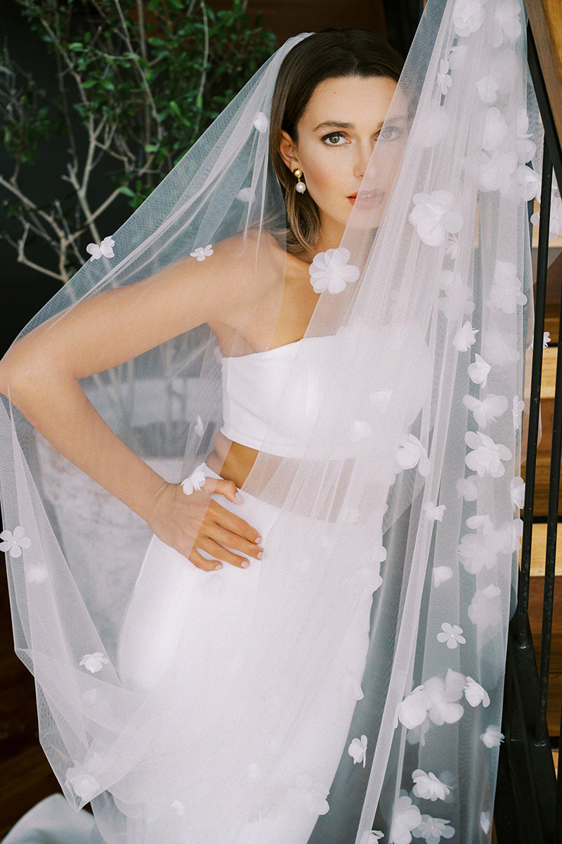 model wears a one-tier handmade three dimensional organza flowers wedding veil, floral veil