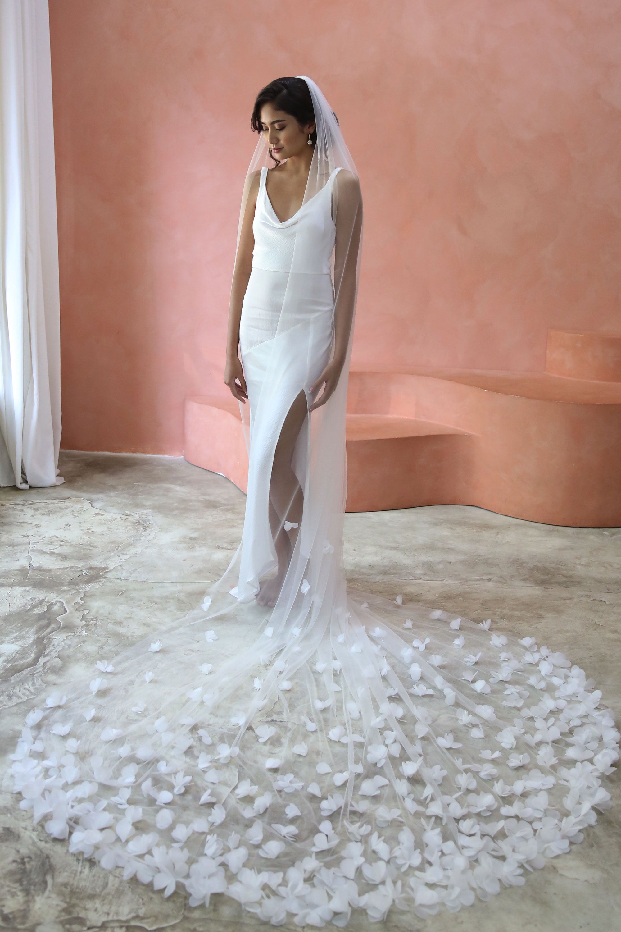 model wears wedding veil with organza flowers, floral veil