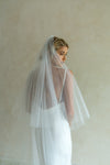 A model wearing a two tier wedding veil by Madame Tulle bridal
