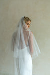 A model wearing a two tier wedding veil by Madame Tulle bridal