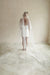A model wearing a long wedding veil with embroidery together forever