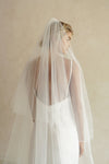 A model wearing a two tier wedding veil