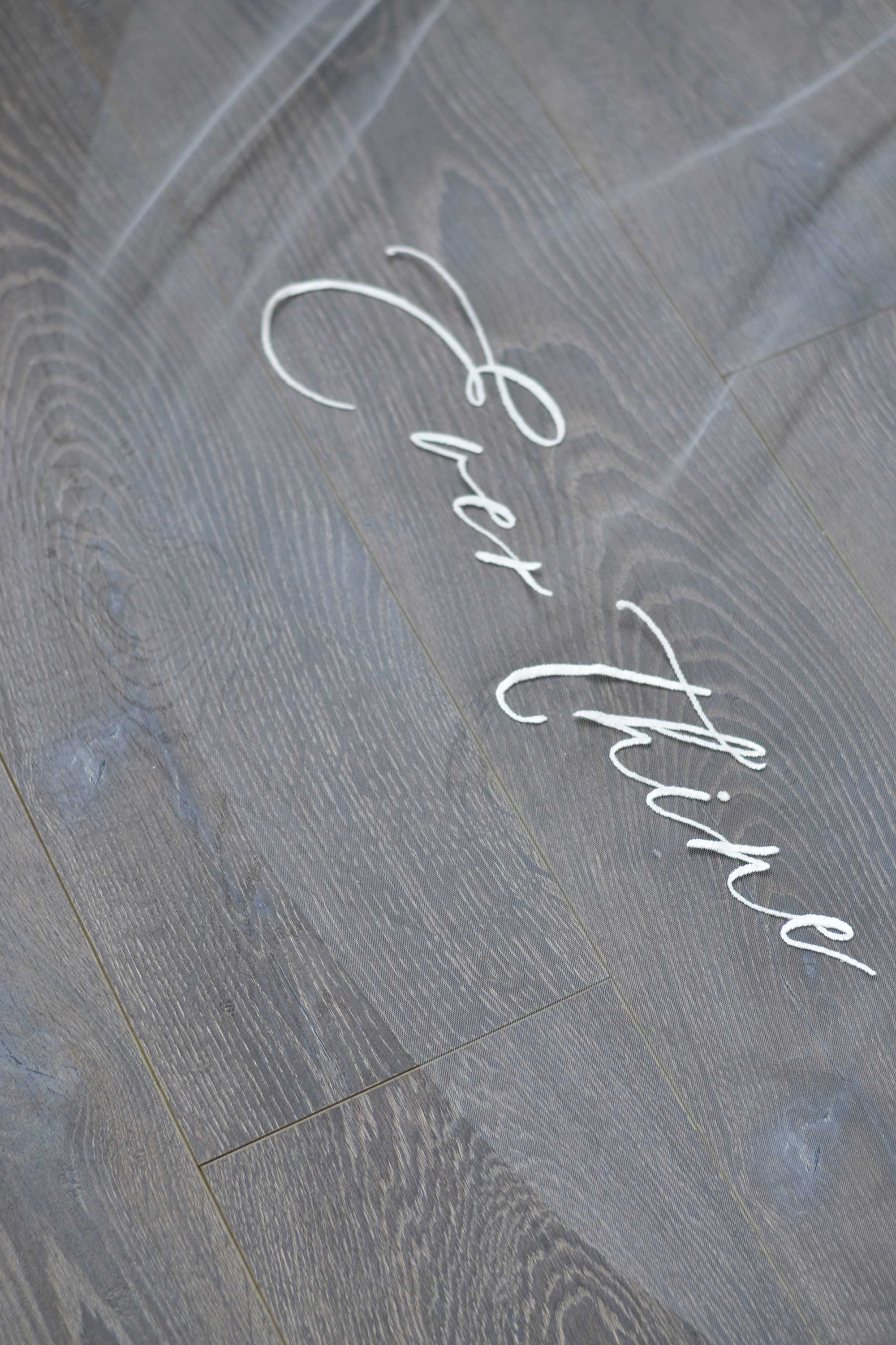 A wedding veil with embroidery text ever thine, ever mine, ever ours