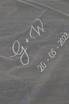 A wedding with personalised embroidery bride and groom&#39;s initials and wedding date