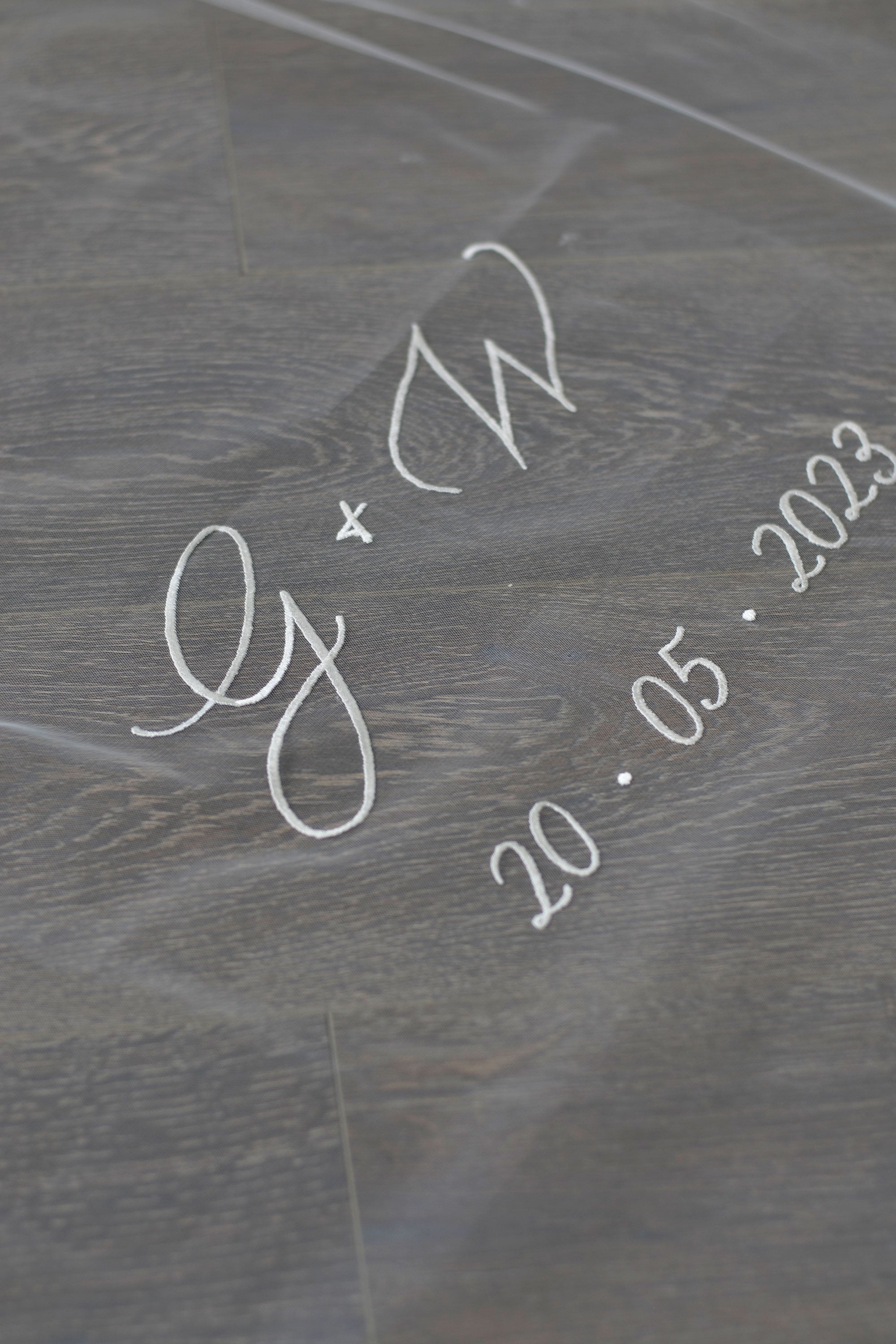 A wedding with personalised embroidery bride and groom&#39;s initials and wedding date