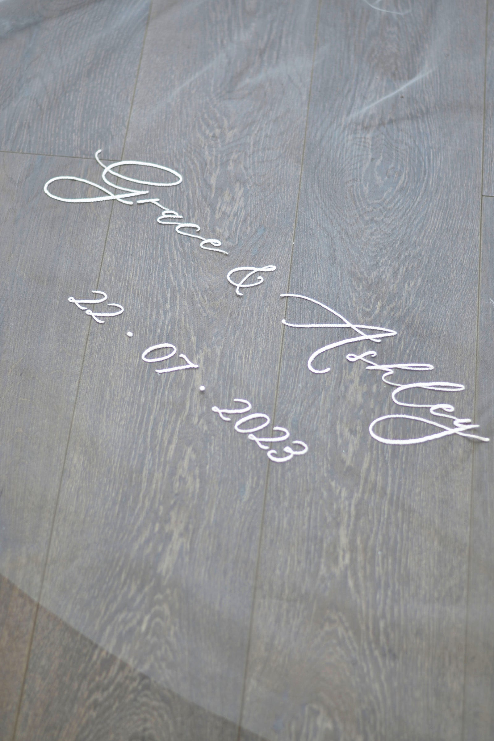 A wedding with veil personalisation embroidery, bride and groom's names and wedding date