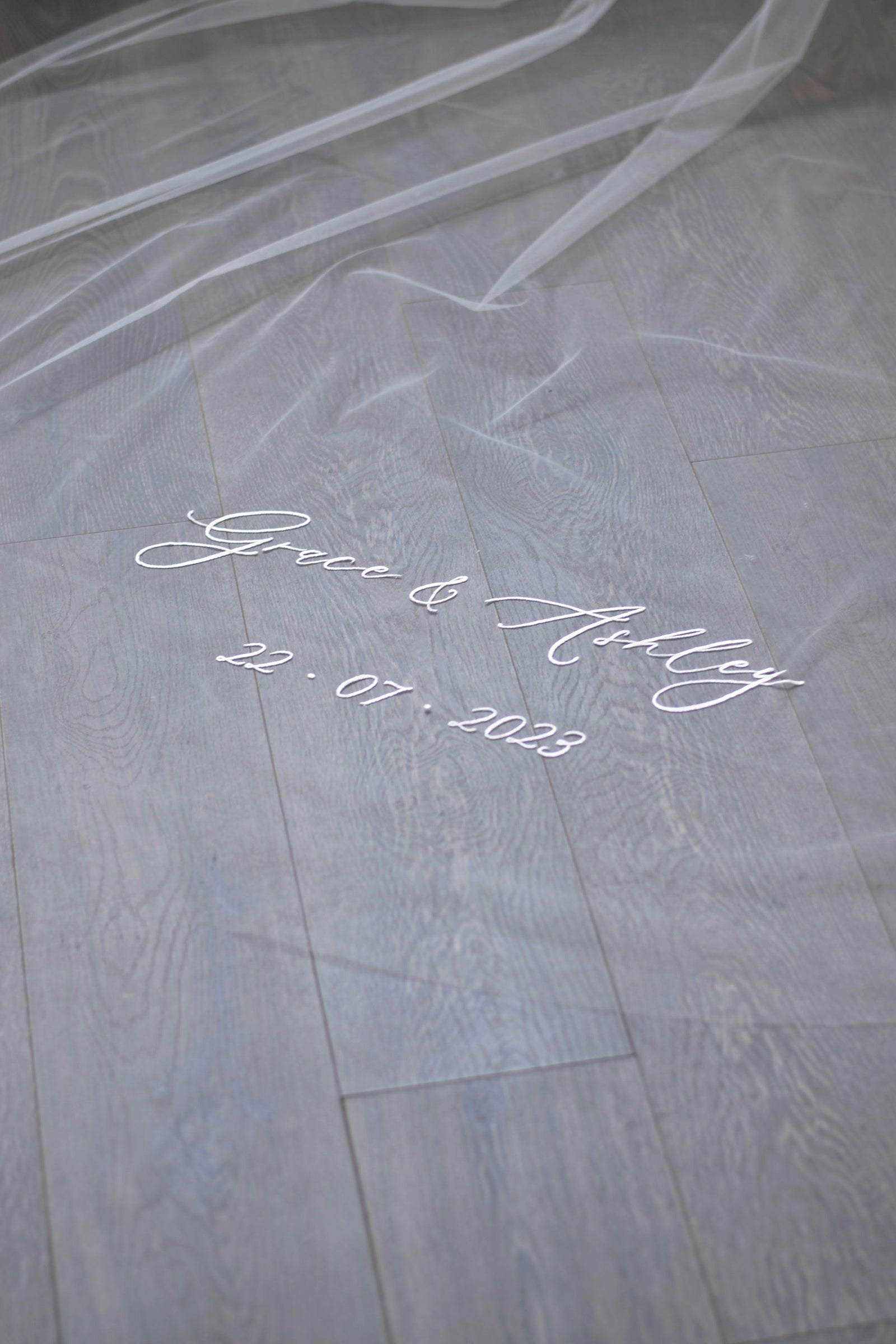 A wedding with veil personalisation embroidery, bride and groom's names and wedding date