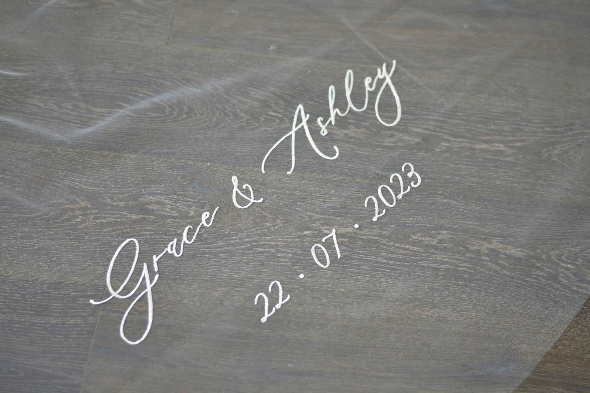 A wedding with veil personalisation embroidery bride and groom&#39;s names and wedding date